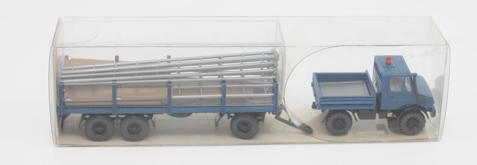 Wiking 27392 HO Unimog U1700 with Stakes and Blue Trailer