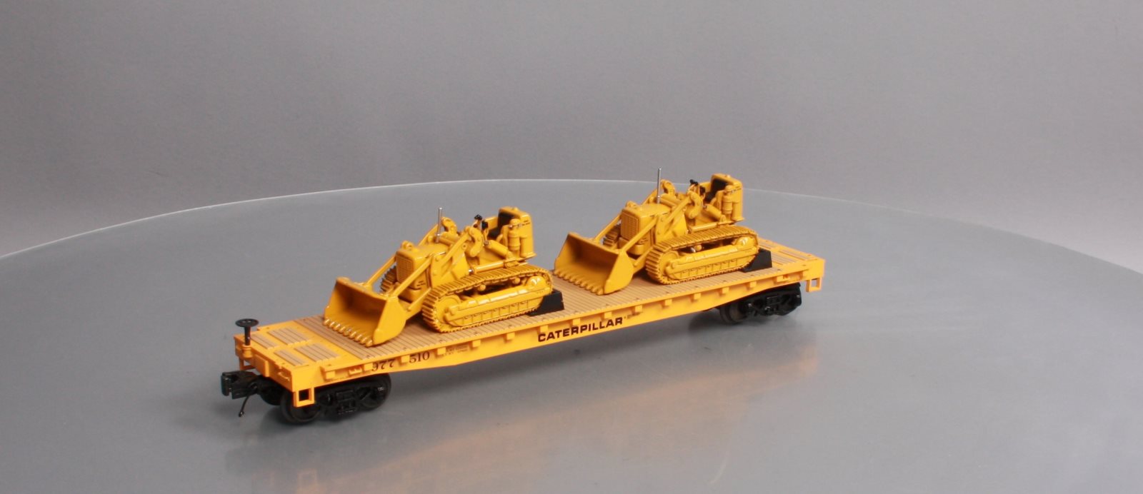 MTH 20-98648 Caterpillar 60’ Flat Car with 2 CAT No. 977 Traxcavators #977516