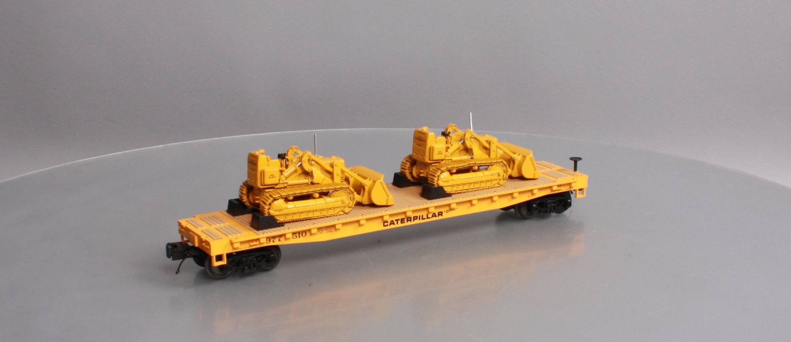 MTH 20-98648 Caterpillar 60’ Flat Car with 2 CAT No. 977 Traxcavators #977516
