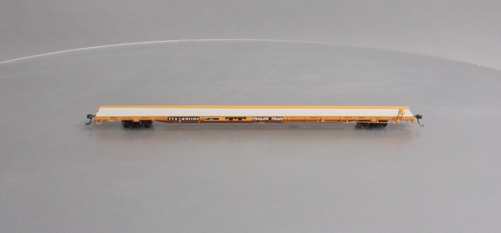 Atlas 20004094 HO TTX 1970s F89J Flat Car (Mid/End Hitches) #601104