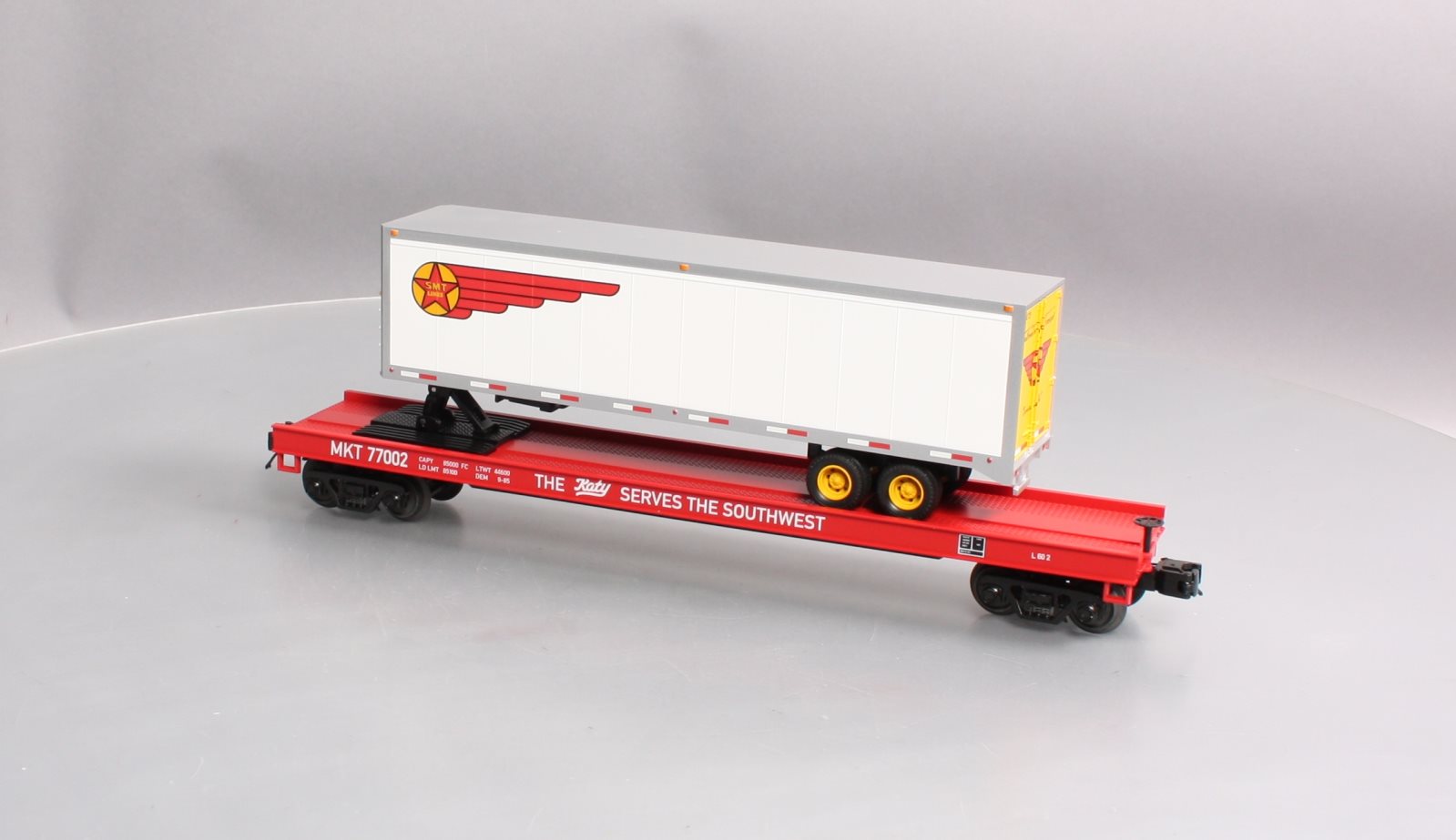 MTH 20-95216 O Missouri Kansas & Texas Railway Premier Flat Car w/ 40’ Trailer