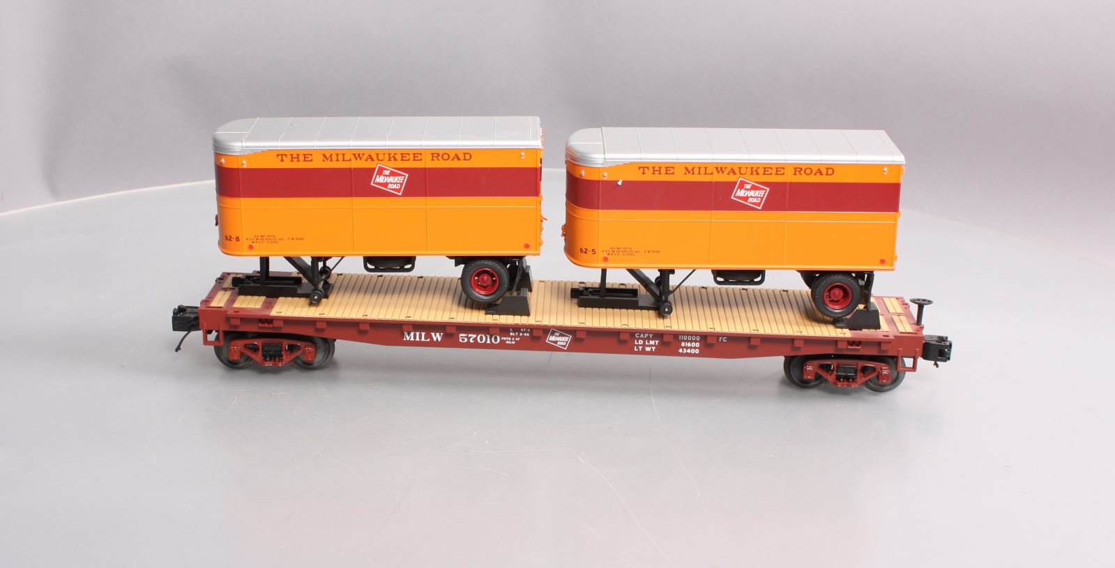 MTH 20-98697 Milwaukee Road Flat Car with 2 PUP Trailers #57010