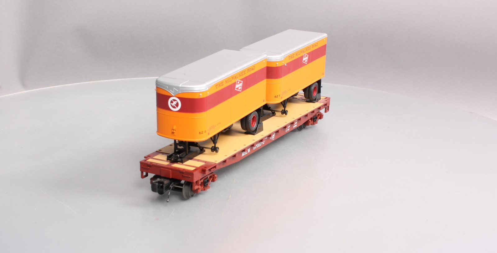 MTH 20-98697 Milwaukee Road Flat Car with 2 PUP Trailers #57010