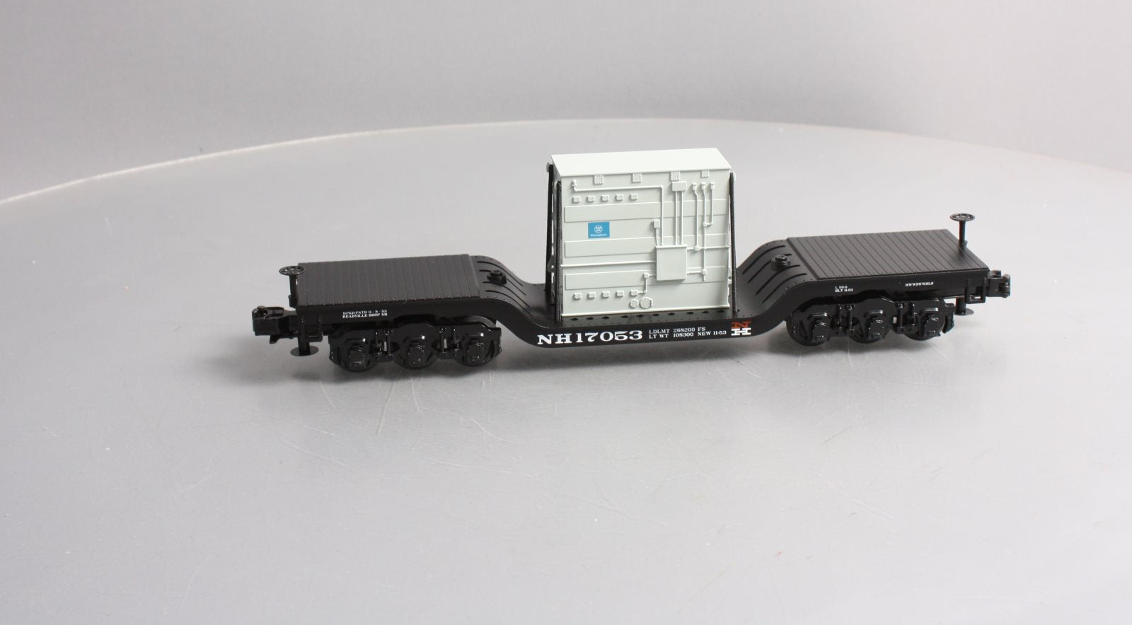 MTH 30-76511 O Gauge New Haven Depressed Center Flatcar w/Transformer Load