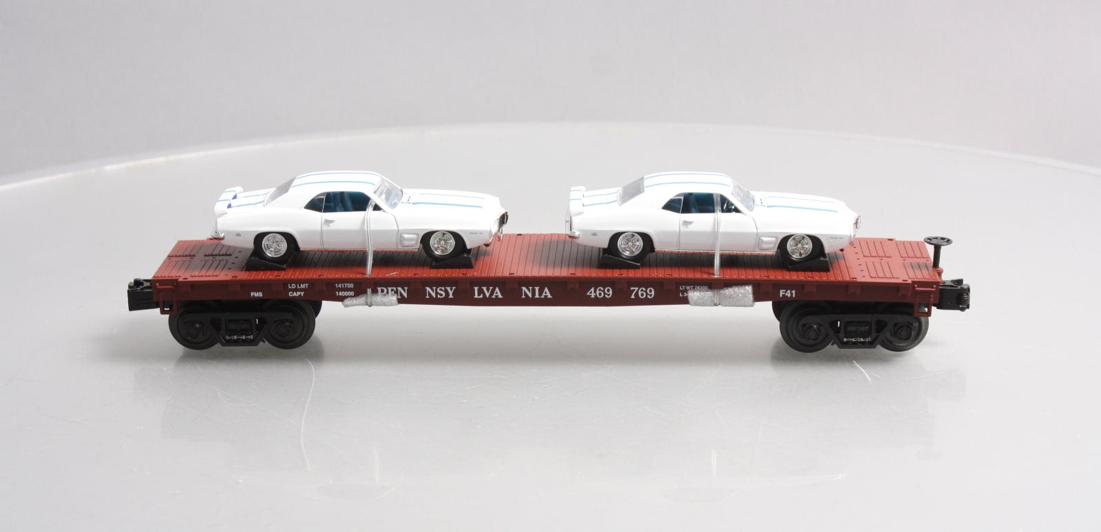 MTH 30-76724 O Pennsylvania Flat Car with 2 '69 Pontiac Firebird (White) #469769