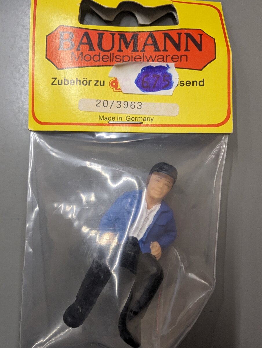 Baumann 20/3963 G Scale Sitting Man in Blue Jacket w/Black Cap