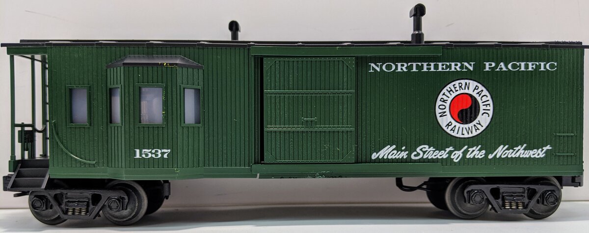 MTH 30-7725 O Gauge Northern Pacific Work Caboose with Bay Window