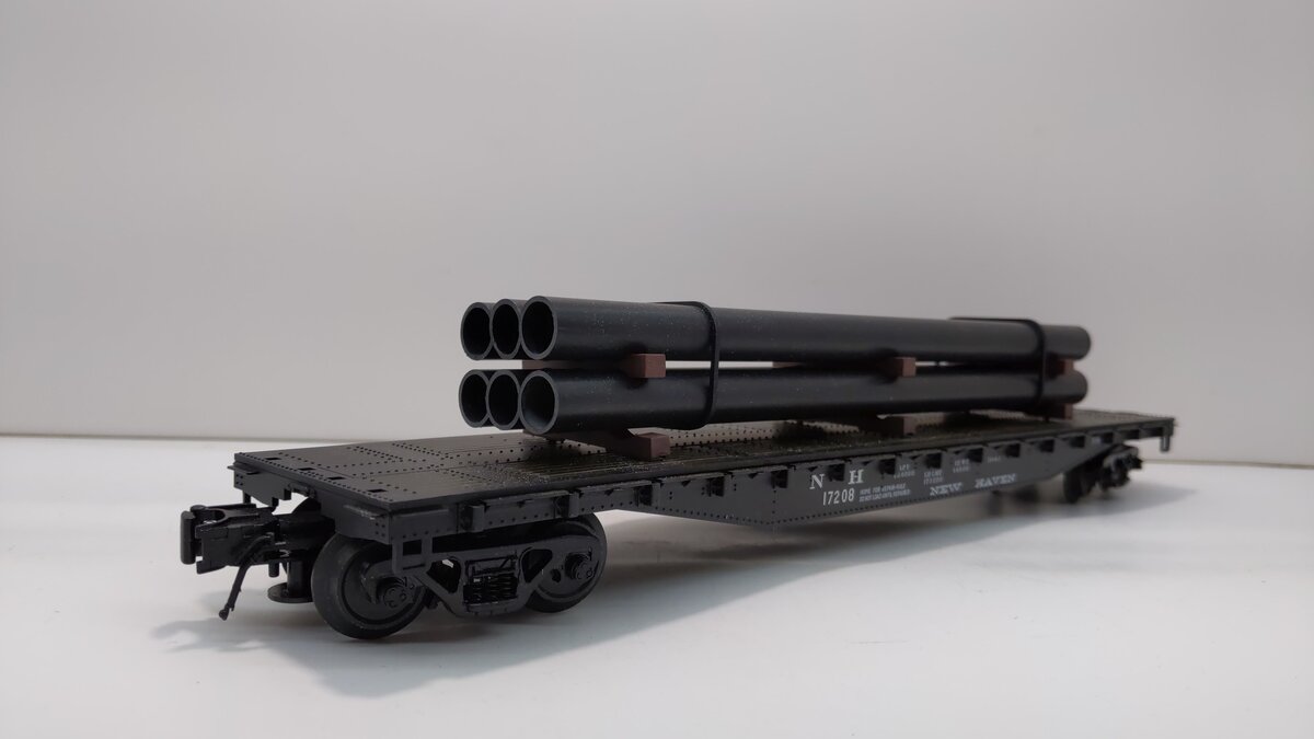 Atlas 933-1 O Gauge New Haven 52'6" Flatcar w/Pipe Load #17208 (3 Rail)